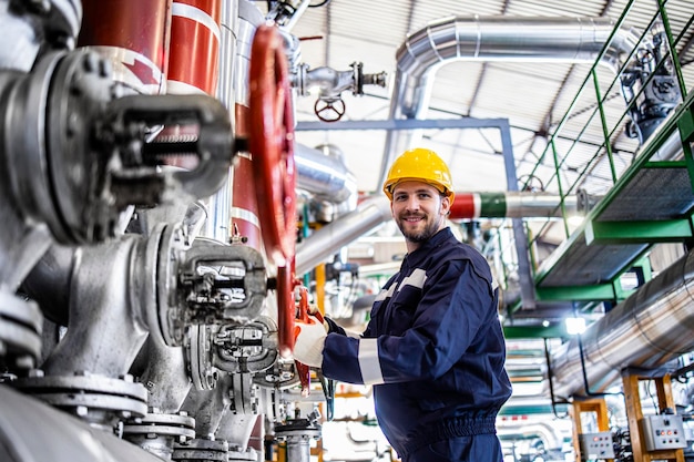 Portrait of an industrial worker in protective work wear in refinery or oil factory