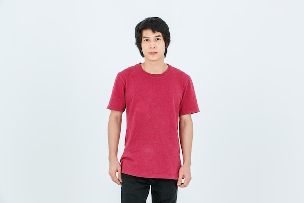 Portrait isolated cutout full body studio shot of Asian young handsome smart confident male model in street style outfit t shirt denim and sneakers standing posing look at camera on white background