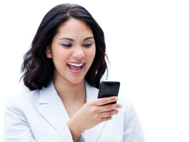 Portrait of a jolly businesswoman sending a text