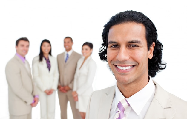 Portrait of latin businessman smiling with his team