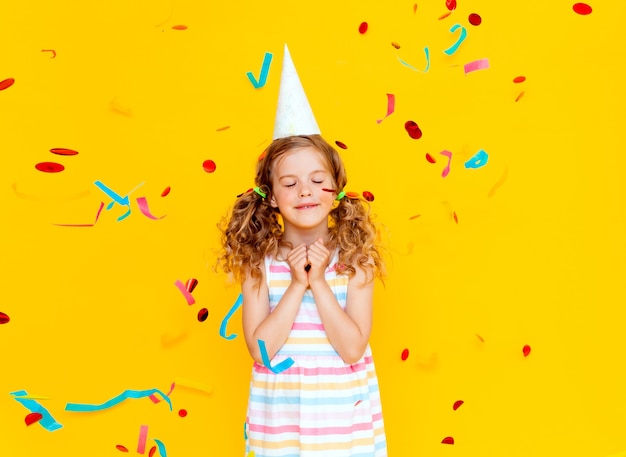 Portrait of a little beautiful girl celebrating her birthday. 