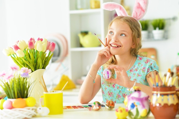 Portrait of little beautiful girl is preparing for Easter