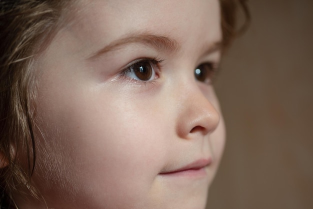 Portrait of little boy. Concept of kids face close-up. Head shoot children profile portrait.