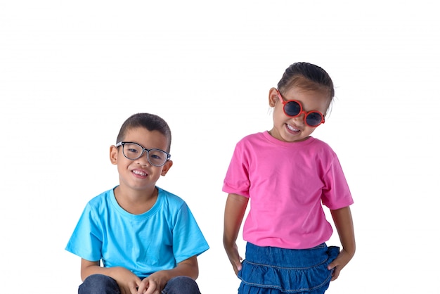 Portrait of little boy and girl is colorful T-shirt with glasses isolated on white background