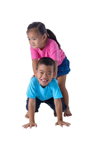 Portrait of little boy and girl is colorful T-shirt with glasses isolated on white background