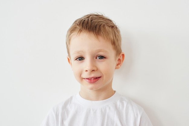 Portrait of little boy on white background