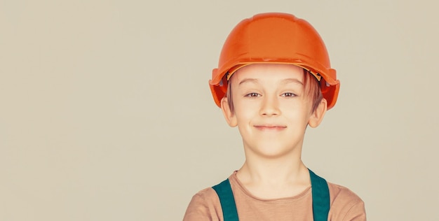 Portrait little builder in hardhats Child building helmet hard hat Little builder in helmet