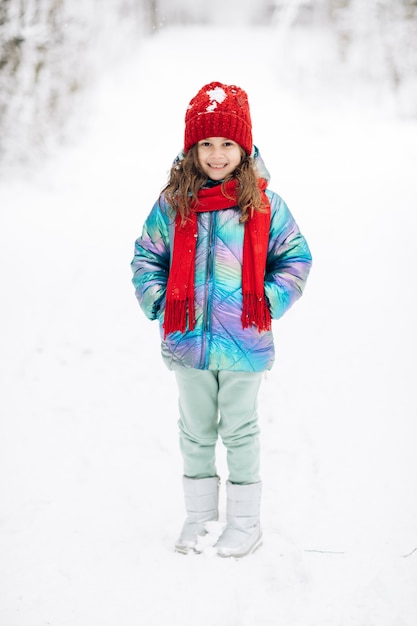 Portrait Little Child Girl Smiling Looking at Camera Standing into Park Outdoor.