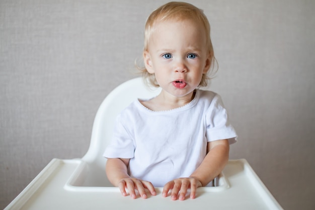 Portrait of a little cute child in a white tshirt