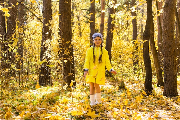 Portrait of little girl in autumn forest