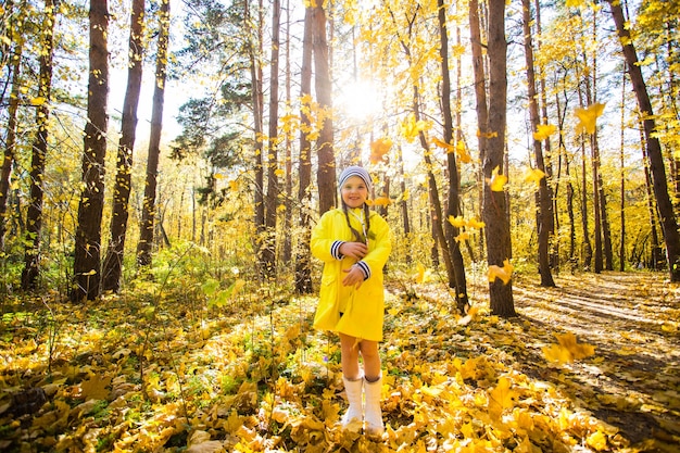 Portrait of little girl in autumn forest