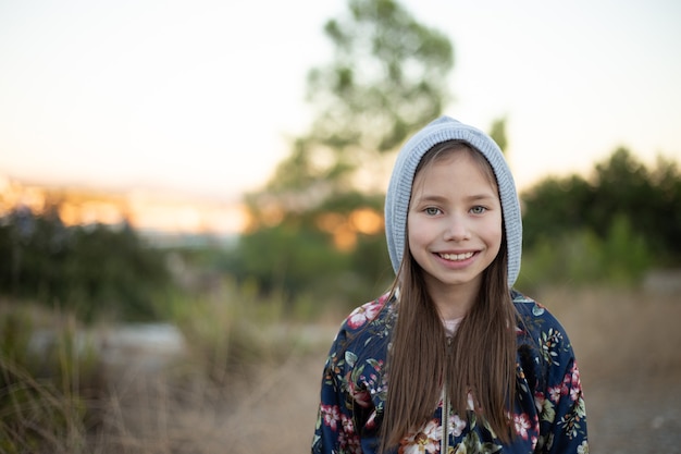 Portrait of little girl in autumn park