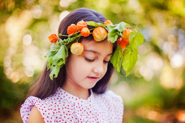 Portrait of little girl in autumn park 