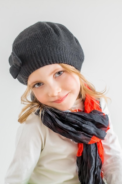 Portrait of little girl black hat and ckarf