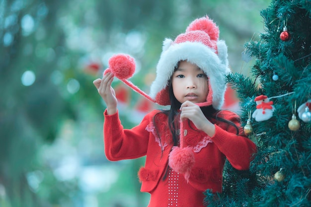 Portrait of little girl in christmas festivalAsian kid winter holiday