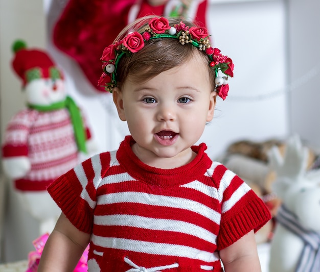 portrait of a little girl in a red dress new year