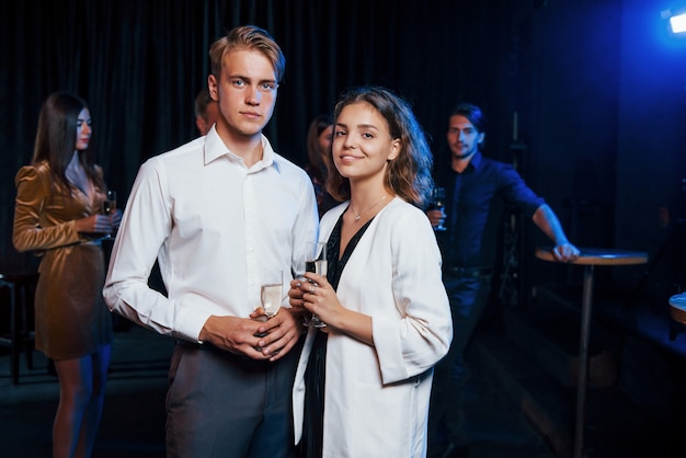 Portrait of lovely couple have party together with their friends.