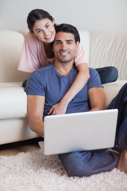 Portrait of a lovely couple using a laptop