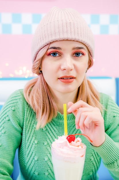 Portrait of a lovely girl with milkshake