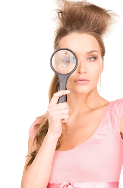 Portrait of lovely woman with magnifying glass