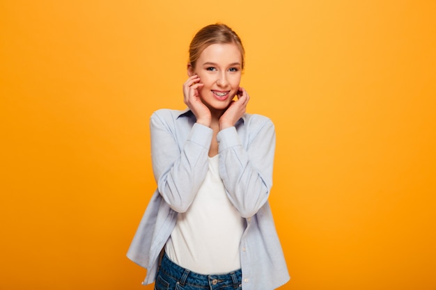 Portrait of a lovely young girl with braces posing