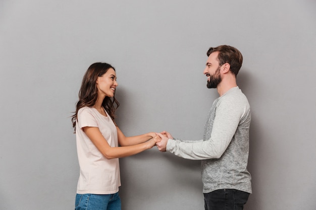 Portrait of a loving young couple holding hands