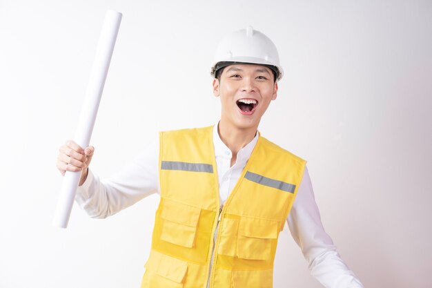 Portrait of male construction engineer with expression on white background