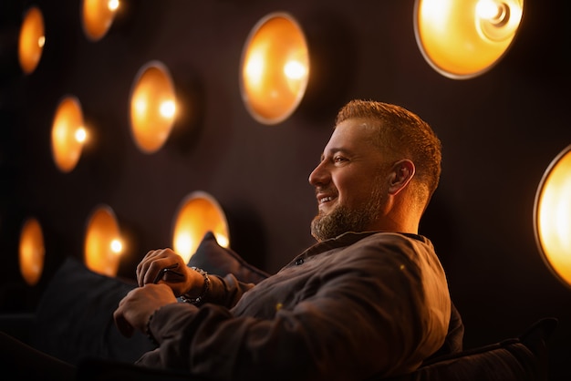 Portrait of a man 45 years old on a dark background