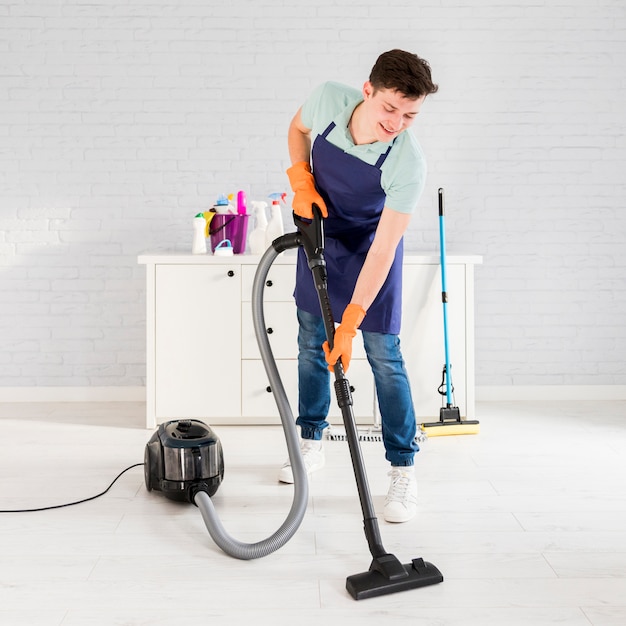 Portrait of man cleaning his house