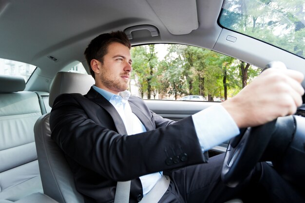 Portrait of a man driving his car