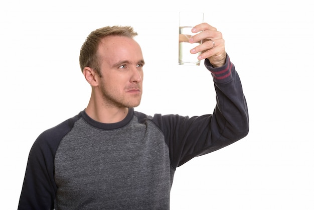 Portrait of man isolated against white wall