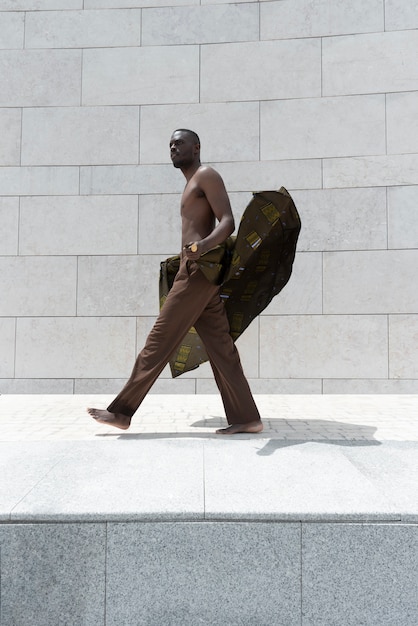 Portrait of man outdoors in traditional african attire