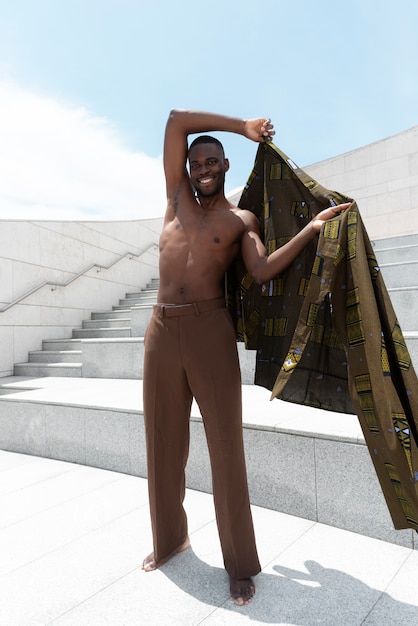 Portrait of man outdoors in traditional african attire