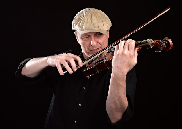 Portrait of a man playing wooden violin