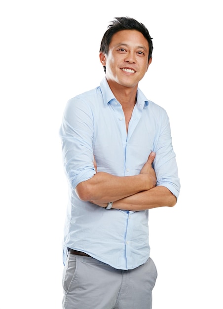 Portrait man and proud asian in studio happy and smile while posing empowered on white background Businessman confidence and young handsome and modern entrepreneur relax and positive isolated