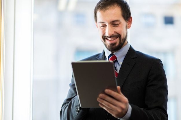 Portrait of a man using a digital tablet