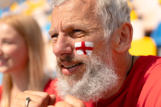 Portrait of man watching a soccer game