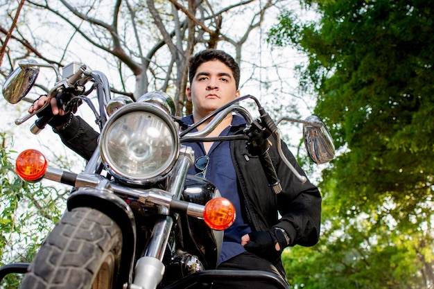 Portrait of a man with his motorcycle Outdoor portrait