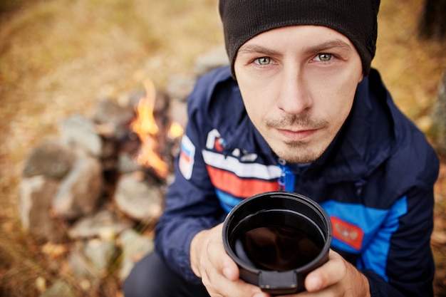 Portrait of a Man with a mug hot tea in his hands