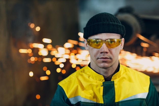 Portrait of man worker Engineer Wearing Uniform protective Glasses at Steel Factory Metal Construction Facility