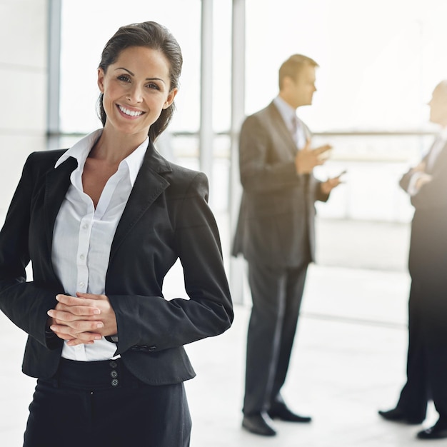 Portrait management and a leader woman in corporate business standing in her office as a professional Leadership company and professional with a happy female manager in her workplace for success