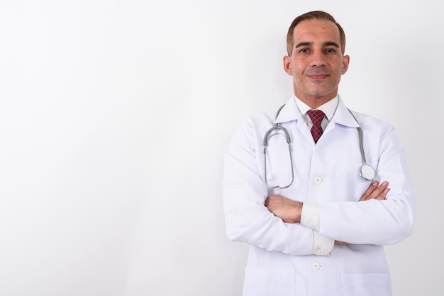 Portrait of mature handsome Persian man doctor