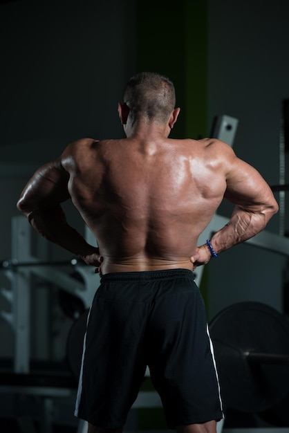 Portrait Of A Mature Physically Fit Man Showing His Well Trained Body  Muscular Athletic Bodybuilder Fitness Male Posing After Exercises