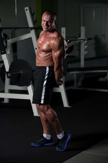 Portrait Of A Mature Physically Fit Man Showing His Well Trained Body  Muscular Athletic Bodybuilder Fitness Male Posing After Exercises