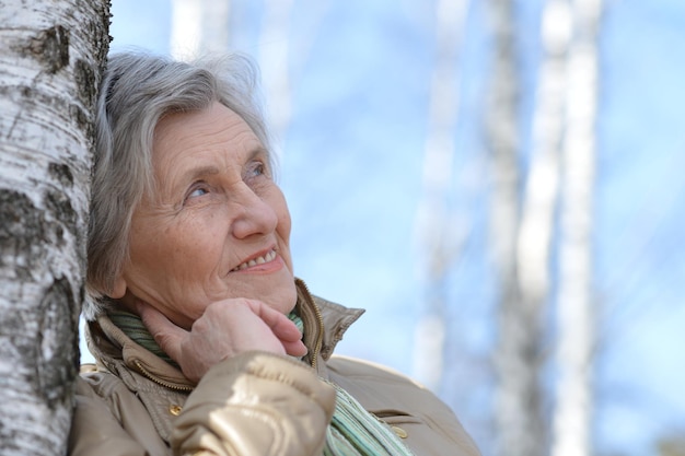 Portrait of a mature woman out for a walk in nature in spring