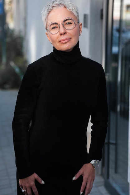 Portrait of a mature woman with grey hair and eyeglasses Casual look