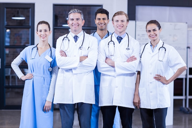 Portrait of medical team standing together and smiling in hospital