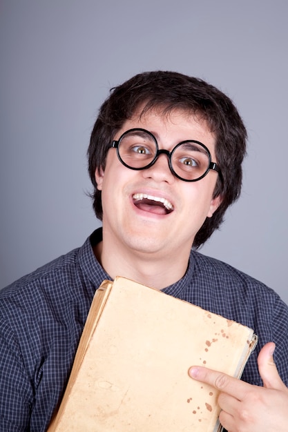 Portrait of men with book and glasses. 