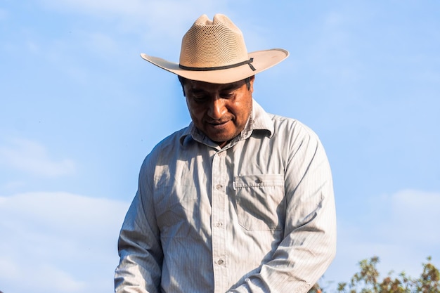 Portrait of a Mexican Farmer Planting Beans with Passion