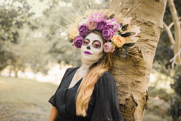 Portrait of Mexican woman made up as a catrina